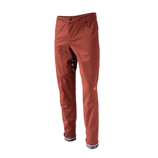 Rock pants in rust red for climbing with stretch panel in native red and zip pocket above knee