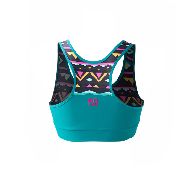 SO SOLID back view of reversible sports bra in turquoise with partial native pattern in gray with pink details - made out of recycled nylon