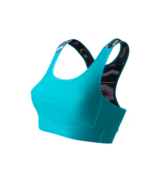 SO SOLID Front view of reversible sports bra in turquoise with partial native pattern in gray with pink details - made out of recycled nylon