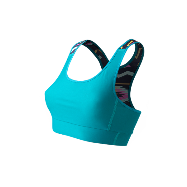 SO SOLID Front view of reversible sports bra in turquoise with partial native pattern in gray with pink details - made out of recycled nylon